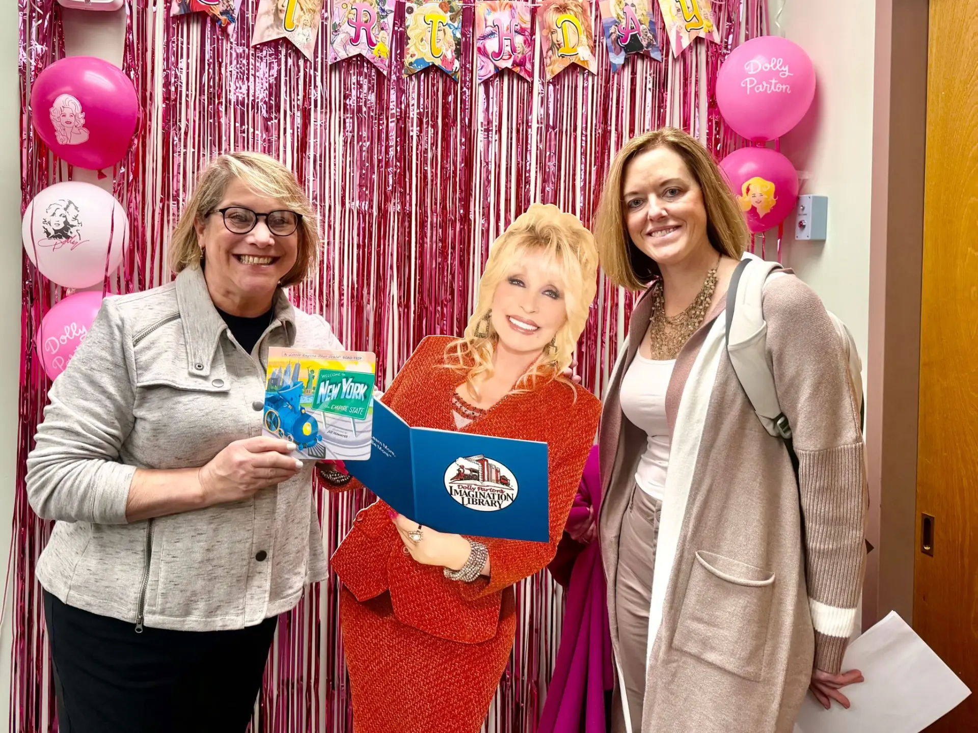 BIANYS representatives with the Dolly Parton Imagination Library display during Advocacy Days in Albany