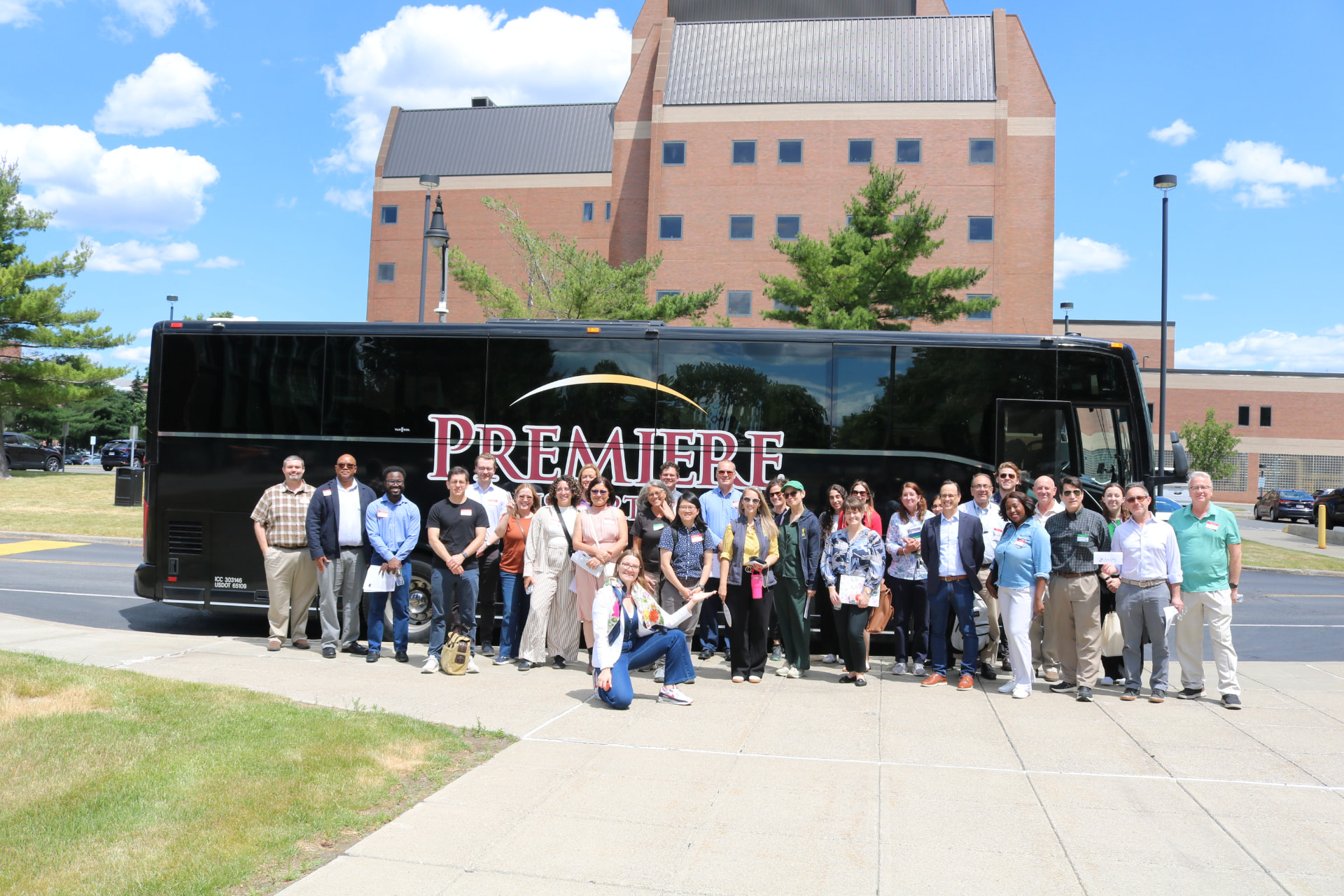 Conference attendees gathered in front of the bus during BIANYS' first incubator bus tour