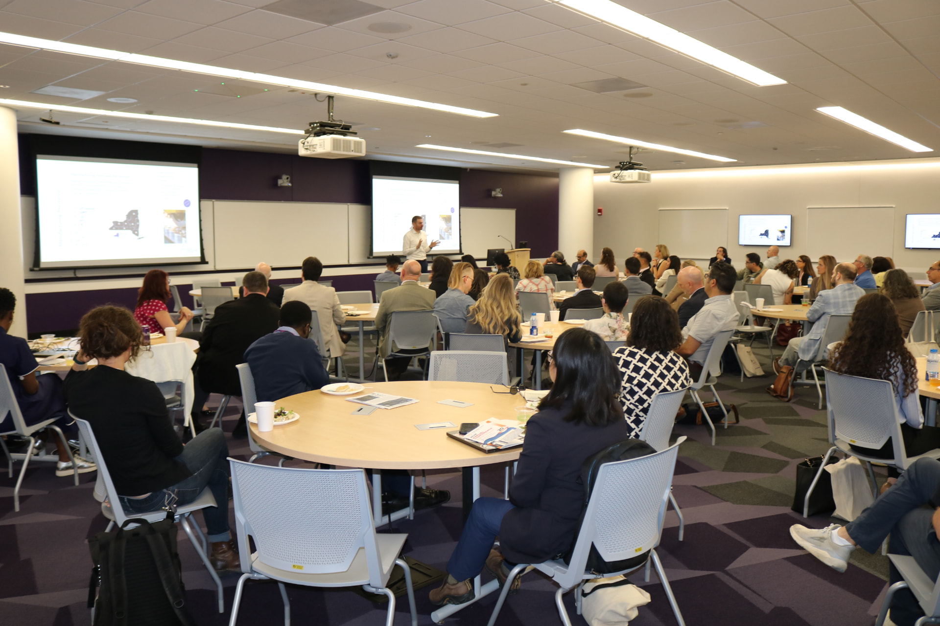 A full room of attendees during day two panels at the University at Albany